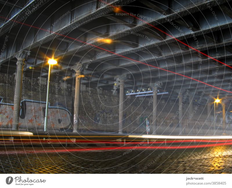 new light tracks in the old tunnel Tunnel Bridge Traffic infrastructure Cobblestones Street lighting Tracer path Speed Mobility Nostalgia Time Underpass Column