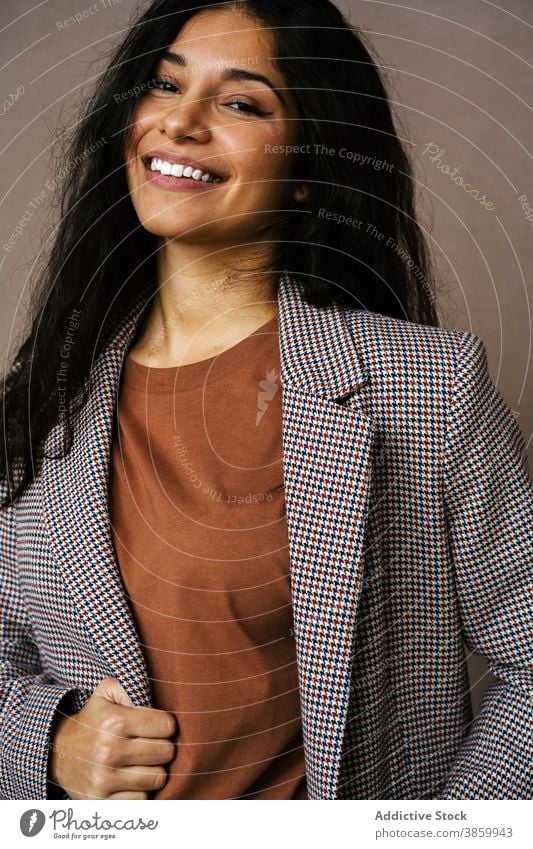 Cheerful woman in stylish wear in studio style jacket trendy laugh cheerful having fun model charming female ethnic happy young pleasure relax optimist modern