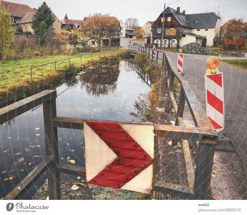 Security measure Village Street houses Saxony Lausitz forest Electricity pylon village pond Lake Water reflection Sky rail Reflection Cloudless sky windless