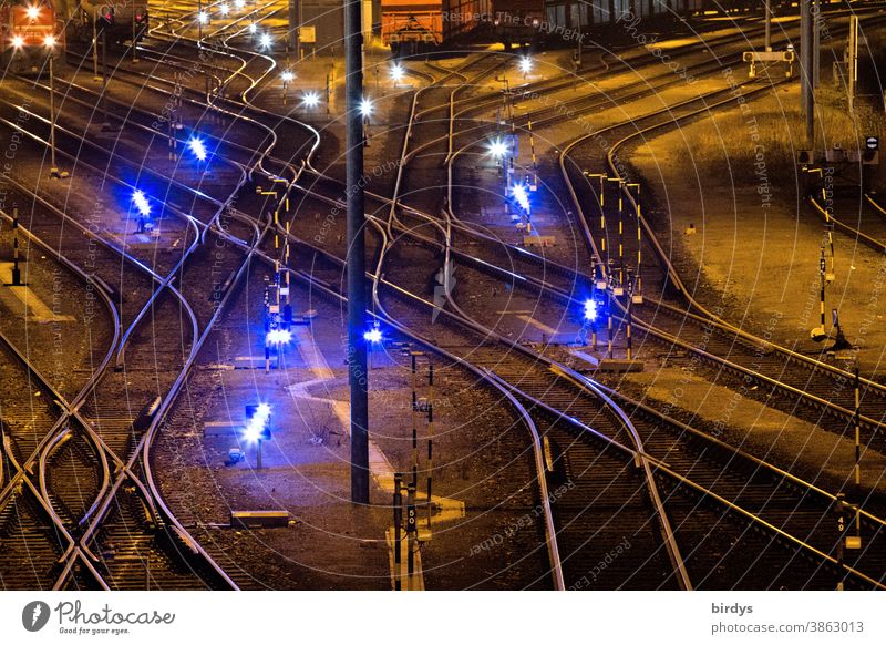 Goods station with many tracks and switches. Lights. Night shot. Railway Railroad system Freight station Railroad tracks Switches Logistics Many clearer curves