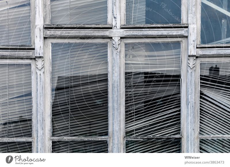 Behind this window, there's no movement for a long time Window Window frame Weathered Old Ornate Venetian blinds obliquely Broken Glass reflection