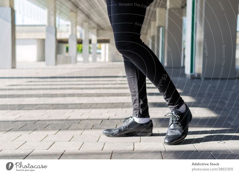 Ethnic man in stylish outfit walking along street - a Royalty Free Stock  Photo from Photocase