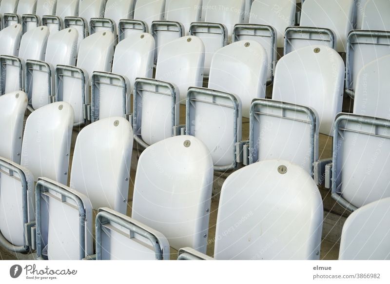 empty rows of seats in a grandstand / plastic chairs / seating Stands Grandstand Plastic chair Chair grandstand Empty plastic seats Auditorium flipped up
