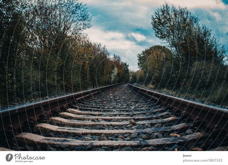 railway tracks in the landscape - blue sky and white clouds on the horizon Railroad tracks Train Track Transport Railway track Rail vehicle Parallel Sky off