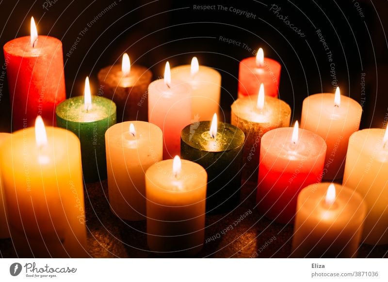 Many colourful burning candles Candlelight variegated cauterizing blaze Candlelit ambience Various