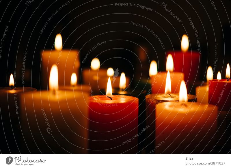 Many colourful burning candles Candlelight variegated cauterizing blaze Candlelit ambience Various Cozy atmospheric