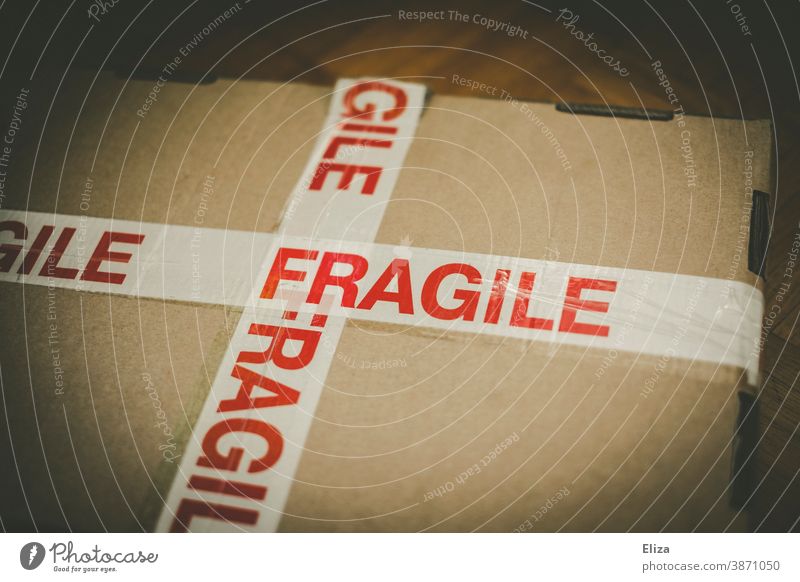 A package marked Fragile - fragile. Package Mail Caution Packaging Delivery Inscription Warn precious online shopping Mail order selling mail dispatch Logistics
