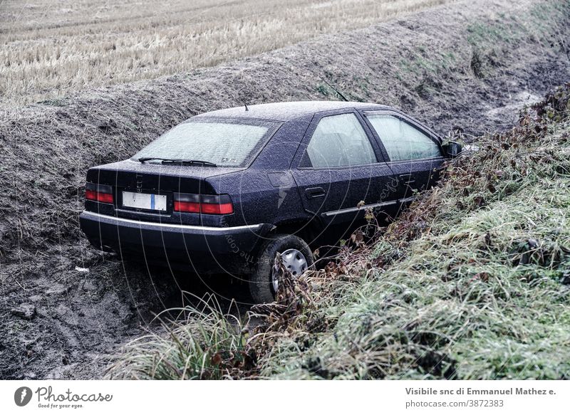 car ended up in a ditch due to ice in Lombardy, north Italy damaged accident crash drift wreck winter broken vehicle behaviour destroyed circulation route