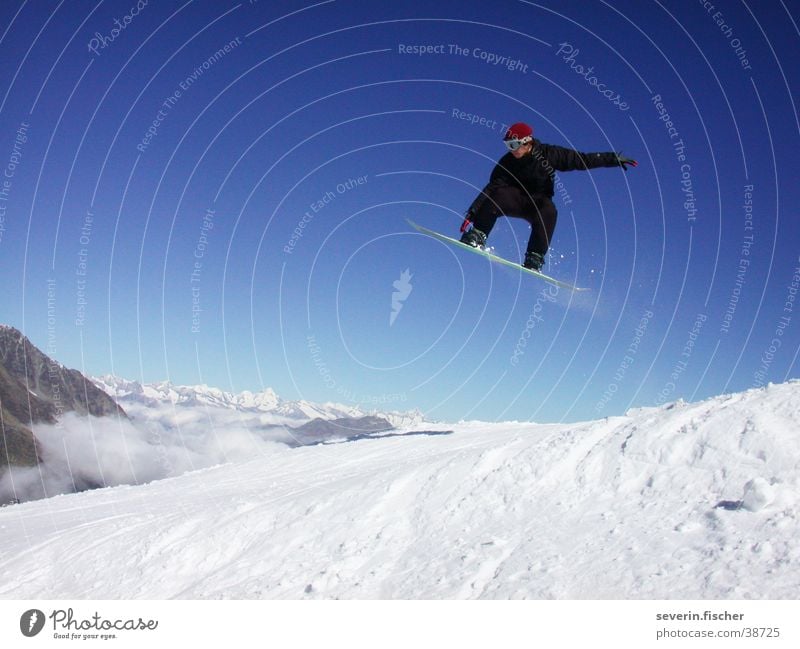 jibber Switzerland Winter Canton Wallis Snowboarding Straight jump Jump Sports Saas Fee grap Mountain Air Snowboarder Trick jump
