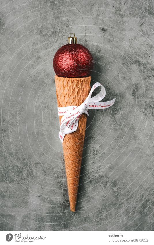 Christmas concept background. Christmas red ball in ice cream cone christmas christmas background Ice cream cone delicious pastry candy overhead Christmas ball