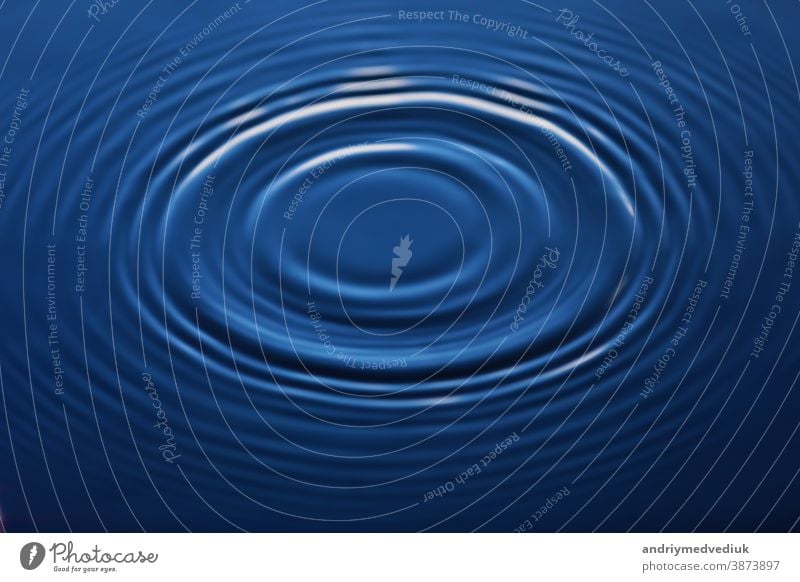 A drop of water falls into the water, making a perfect splash of drops transparent ripple blue purity wave background abstract rippled reflection motion clear