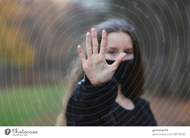 Woman Stretches Out Her Outstretched Hand On Which The Word Stop Is Written Into The Camera Saying No Showing Boundaries A Royalty Free Stock Photo From Photocase