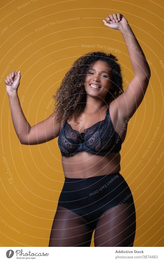 Overweight ethnic woman in lingerie in studio - a Royalty Free