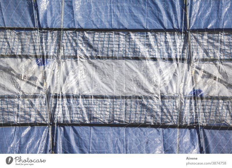 Tarpaulin lashed Construction site tarpaulin fixed sealed tight Scaffolding Shadow seal off Screening Protection Safety secure impenetrable obstructed too