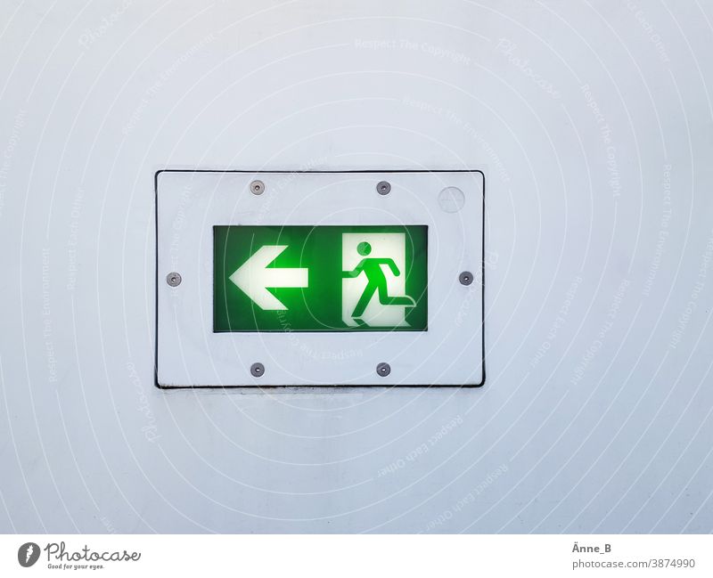 Escape route to the left Emergency exit Emergency exit to the left escape route Signal Green Safety escape route marking Rescue sign Flee Emergency lighting