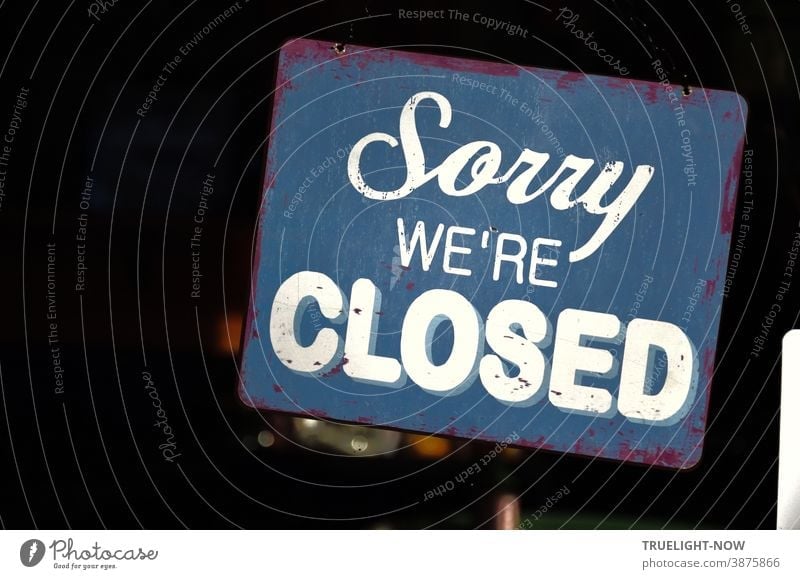 Sorry we're CLOSED Blue vintage metal sign with white lettering in the window of a restaurant has special meaning in the pandemic lockdown time of bankruptcies | Corona Thoughts