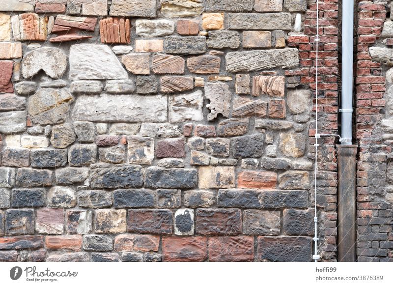 Sandstone facade with downpipe and lightning conductor sandstone wall Downspout Lightning rod Drainpipe Standing stone Castle wall Facade Old town old townhouse
