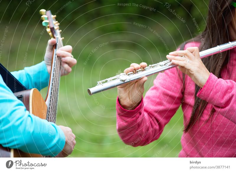Two women making music Make music Music Guitar Transvers flute musicians at the same time unplugged Acoustic Outdoors Musical instrument Musician Interaction