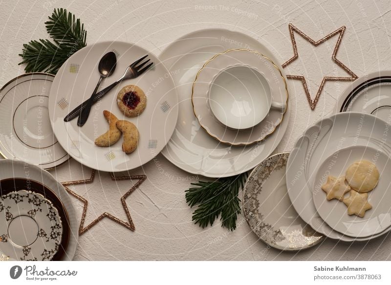 Various plates with pastries and Christmas decoration plate with white background Plate Coffee cup Coffee table coffee service Colour photo To have a coffee Cup