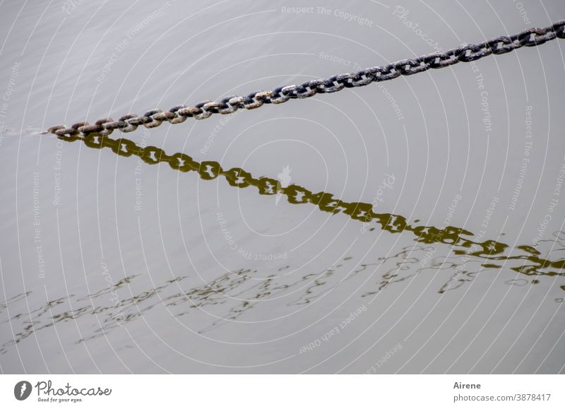 chained up Chain Water Contrast Reflection Barrier Neutral Background Black Block Wet Waves Long Maritime Gray ship chain Silver Dazzling somber Shadow fixed