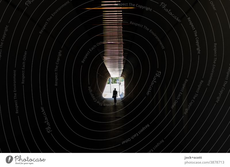 Alone in the dark Tunnel Silhouette Back-light Lanes & trails Passage Pedestrian Tunnel vision Low-key Going Symmetry Identity Architecture Center point Posture