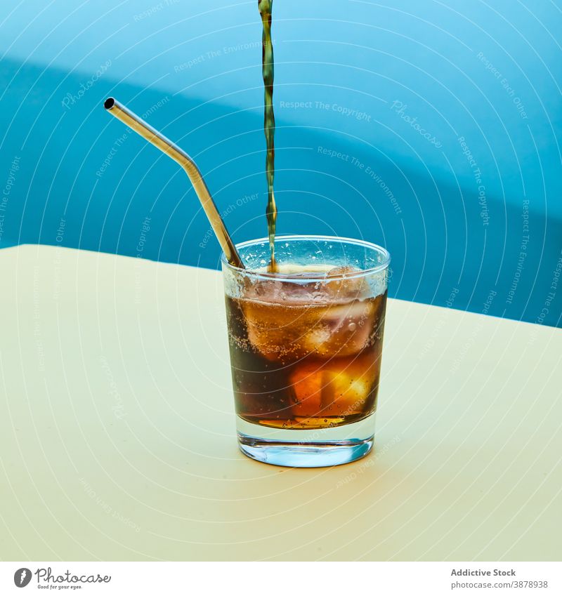 https://www.photocase.com/photos/3878938-glass-of-cold-soda-with-metal-eco-friendly-straw-on-table-photocase-stock-photo-large.jpeg