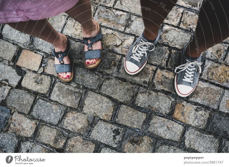 Man and woman photographed from above on feet Feet up Human being Exterior shot Vacation & Travel Colour photo Toes Footwear Sandals Sneakers sneakers