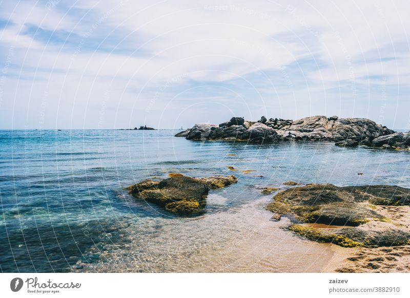 Seascape of a beautiful cove with some steep rocks in the water costa brava calella de palafrugell palamós landscape views sea mediterranean catalonia shore