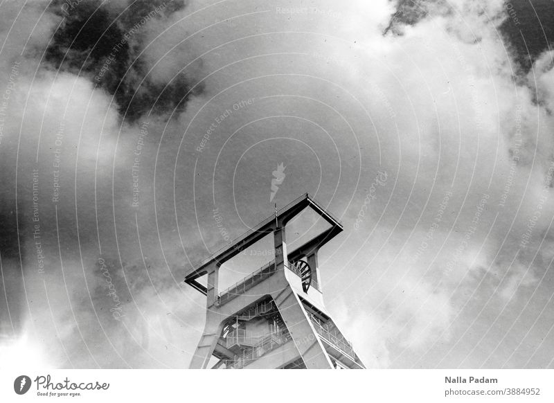 Retired winding tower Analog Analogue photo Black & white photo mining museum Clouds Sky Exterior shot Deserted Day Industry The Ruhr Architecture Metal