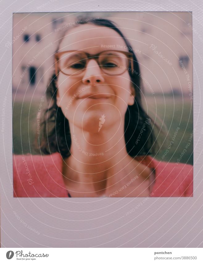 Polaroid selfie. Woman with glasses and brown hair in front of a house. Head up Selfie Self-confident Smiling Impish Eyeglasses Neck Face Brunette gray hair