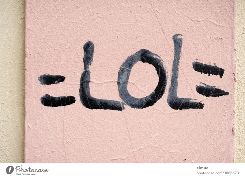 "=LOL=" is written in black print letters on a pink plastered wall / net jargon / youth language lol Net Jargon Laughter Compromise loud laughter Text message