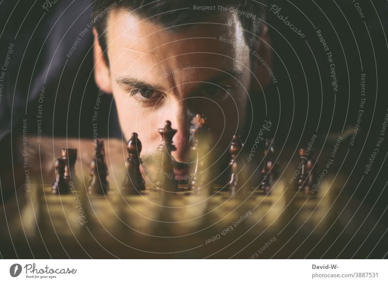 Man plays chess Prospect of success Success strategy concept planning Safety Playing challenge Chess Chessboard Intellect Think strategist Ambitious Duel