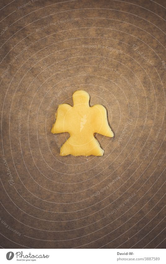Angel cookies for Christmas as dough cut out on baking paper Christmas baking Cookie Christmas & Advent cookie cutter Christmas biscuit Baking christmas time