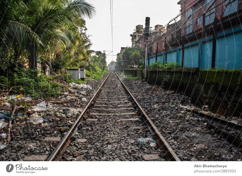 Empty railway tracks creating vanishing point. Indian railways and transport summer street urban background direction empty industry iron journey landscape line