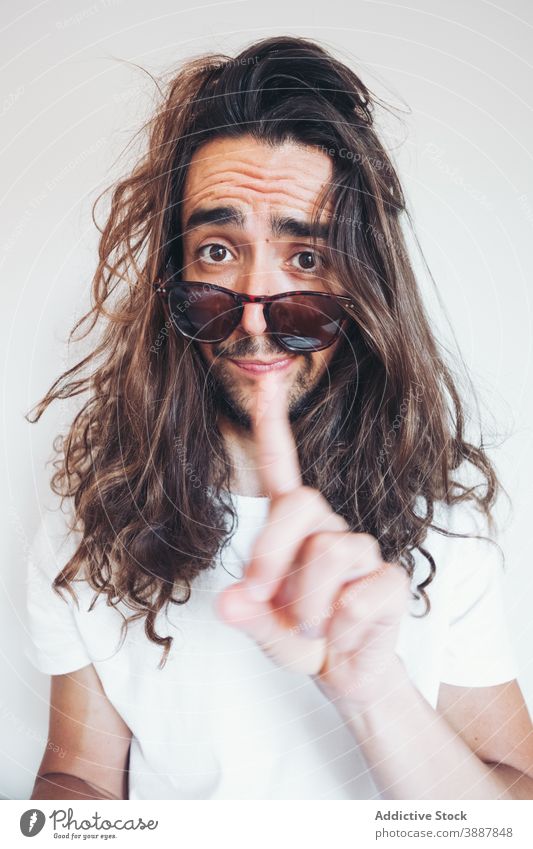 Hipster man with funny surprised face looking at camera amazed hipster long hair beard sunglasses human face expressive selfie young male grimace unbelievable