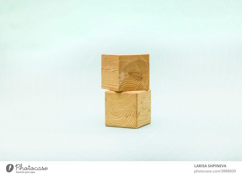 Abstract pastel background with two wooden geometric shapes. Form of wood cubes box for eco product. Empty showcase inminimal style. podium pedestal template