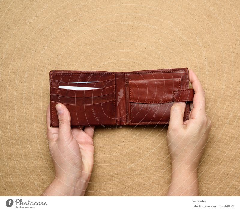 Empty Purse With Coin In Hand On The White Background Stock Photo, Picture  and Royalty Free Image. Image 5821736.