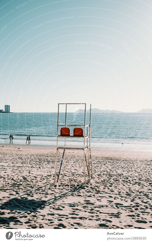 Baywatch chairs on the beach in Spain during summer sky vacation water lifeguard tower travel ocean america us baywatch blue beautiful sand tour tourism