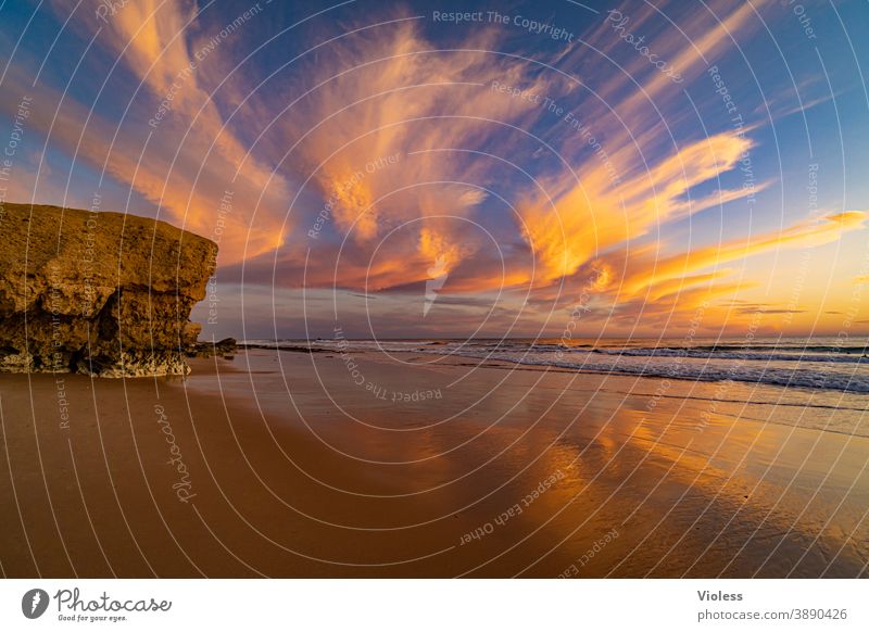 Clouds spectacle at the coast of the Algarve II Sunset gale Surf Discover Vale Parra Relaxation Portugal Sand Water Beach Landscape Romance Freedom Sunbeam Rock