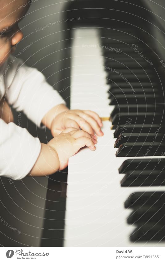 Toddler at the piano Child explore Music Musical instrument Piano Cute Playing inquisitorial cautious inquisitive Culture Parenting Play piano Fingers hands