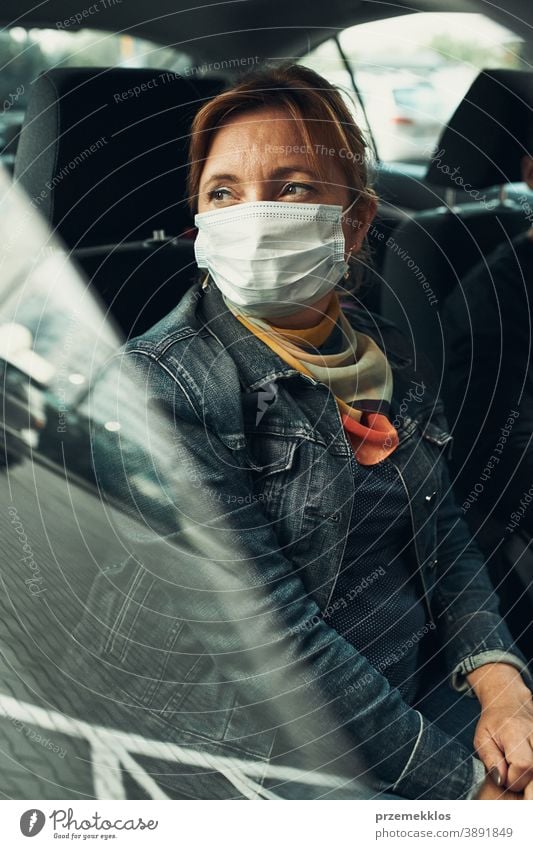 Woman sitting in a car wearing the face mask to avoid virus infection caucasian covid-19 lifestyle outbreak pandemic woman protection protective quarantine care