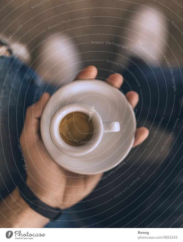 Man holding espresso while sitting on the couch. At home Body Breakfast Brown Brown tone Chill Coffee Colors Cups Depth of Field Enjoyer Enjoyment Fun Hand