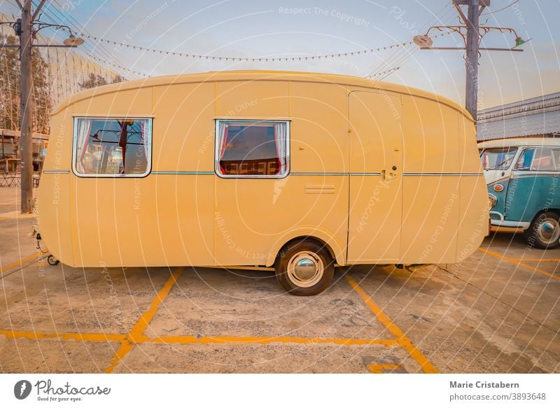 Yellow vintage RV, showing concept of travel and alternative lifestyle road trip yellow motorhome freedom motor home mobile home rv living transportation rustic