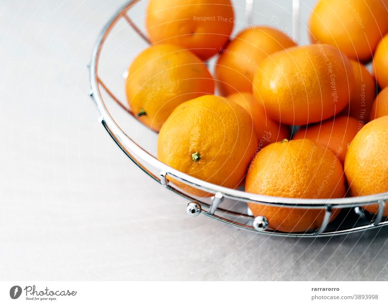 Group of tangerines. Citrus fruit. Orange color of the peel. mandarin clementine group orange citrus health care basket metal fruit bowl ripe tasty sour round
