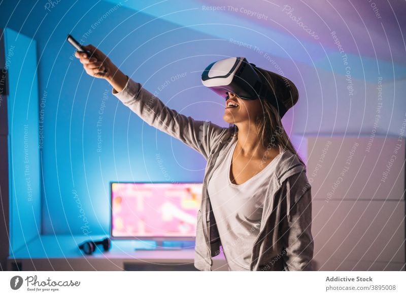 Amazed woman experiencing virtual reality in VR goggles vr excited play game videogame experience amazed shock female gamer gadget entertain innovation glasses