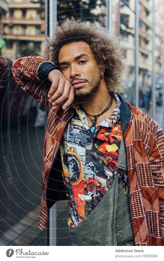 Stylish ethnic hipster man in trendy clothes - a Royalty Free Stock Photo  from Photocase