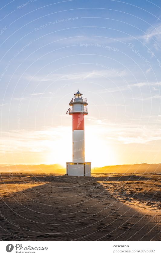 Fangar lighthouse at sunset, Delta del Ebro, Tarragona, Spain architecture arid background beach beautiful blue building catalonia cloud clouds coast coastline