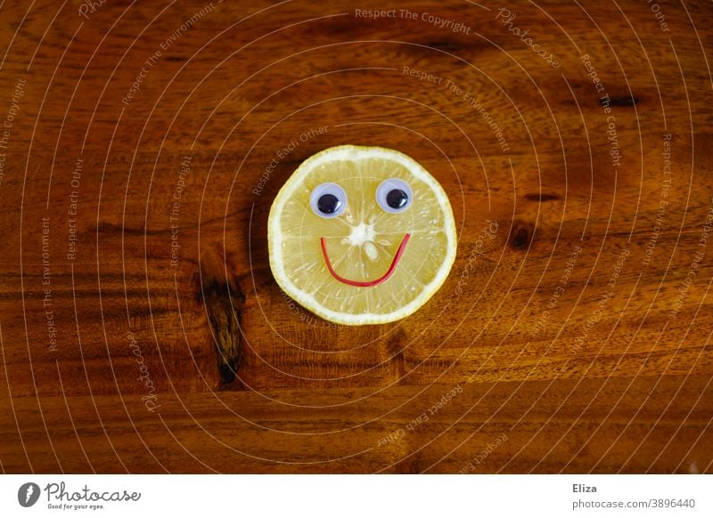 Sauer macht lustig - lemon slice with laughing face on wood Lemon Funny Face Sour cheerful Slice of lemon vitamins salubriously Vitamin C Yellow Food