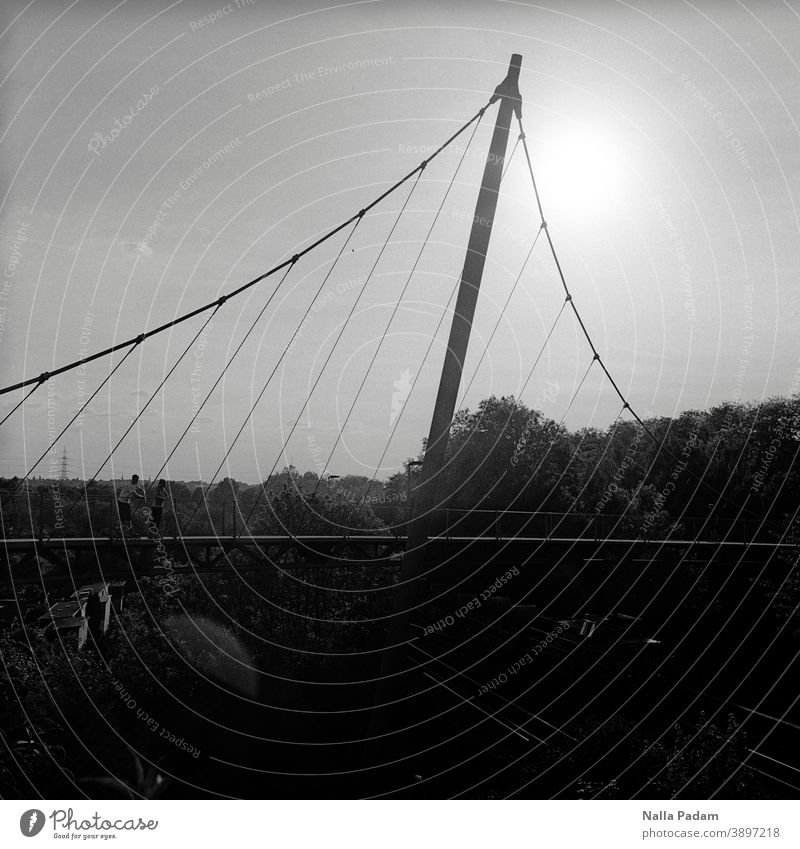 Archway swing and train and sun Analog Analogue photo Black & white photo The Ruhr Bridge Sun loc height Architecture Pole Bochum Exterior shot Town