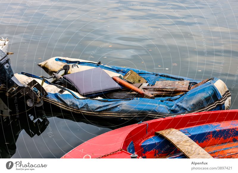 The air's out. airless boat Water Navigation Watercraft Dinghy Death Exterior shot Colour photo Boating trip Deserted Vacation & Travel Summer corona Tourism